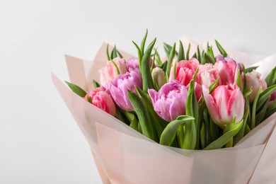 Photo of Bouquet of beautiful tulips on white background, closeup