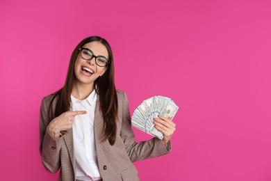 Businesswoman with money on color background. Space for text