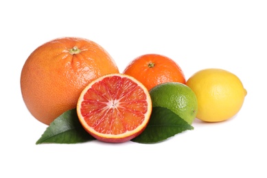 Photo of Fresh juicy citrus fruits with green leaves on white background