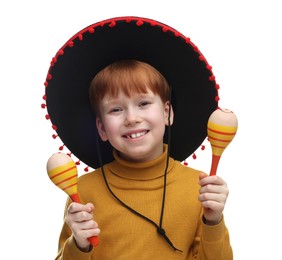 Cute boy in Mexican sombrero hat with maracas on white background