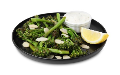 Photo of Tasty cooked broccolini with almonds, lemon and sauce isolated on white