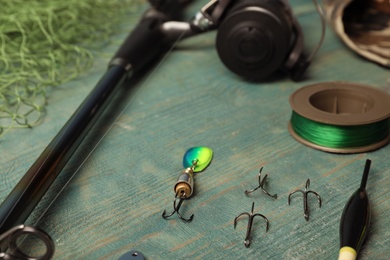 Photo of Fishing tackle on wooden table. Recreational activity