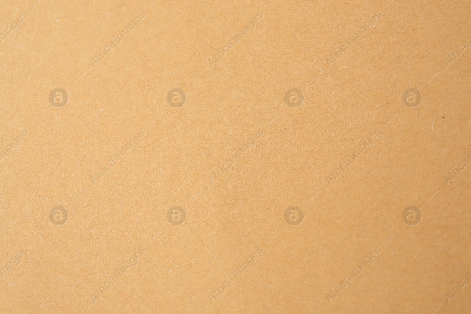 Photo of Texture of beige paper sheet as background, closeup