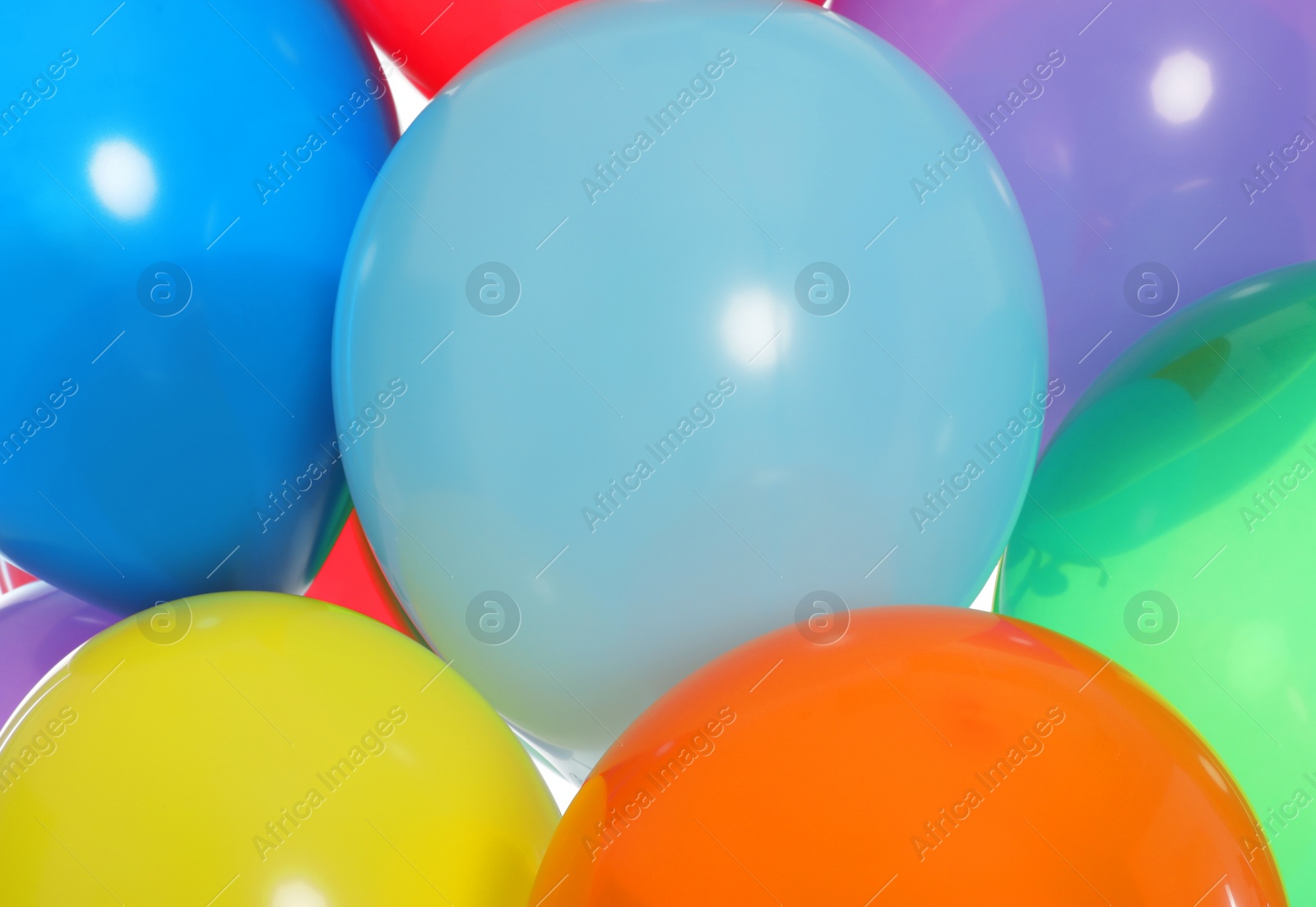 Photo of Group of bright festive balloons as background, closeup