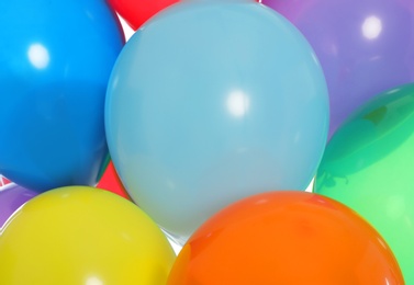 Photo of Group of bright festive balloons as background, closeup