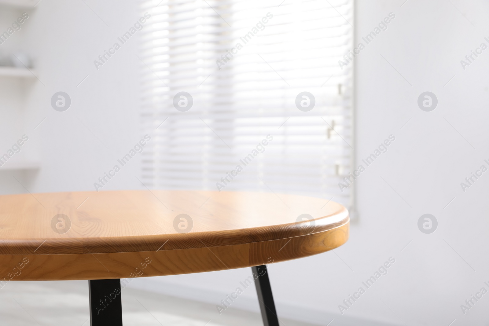 Photo of Empty wooden table indoors, closeup. Stylish furniture