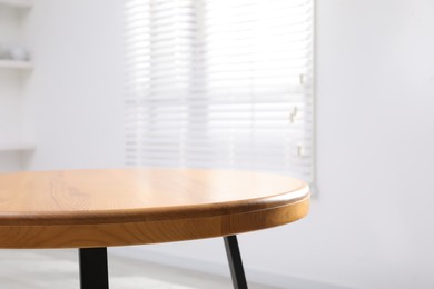 Empty wooden table indoors, closeup. Stylish furniture