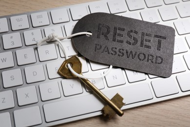 Image of Key with tag RESET PASSWORD on keyboard, closeup