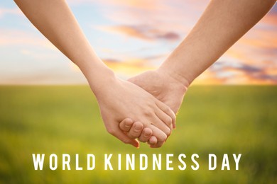 Image of World Kindness Day concept. People holding hands in field, closeup