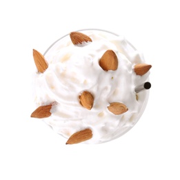 Photo of Glass of delicious milk shake with almond and whipped cream on white background, top view