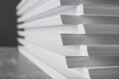 Photo of Stack of blank white paper on table, closeup