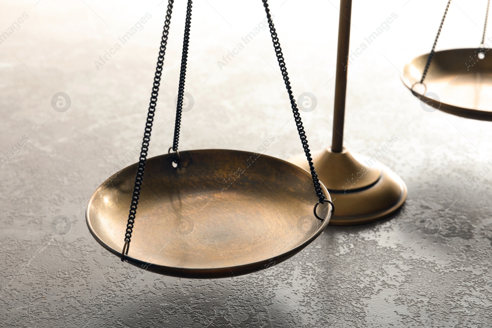 Photo of Scales of justice on table, closeup. Law concept