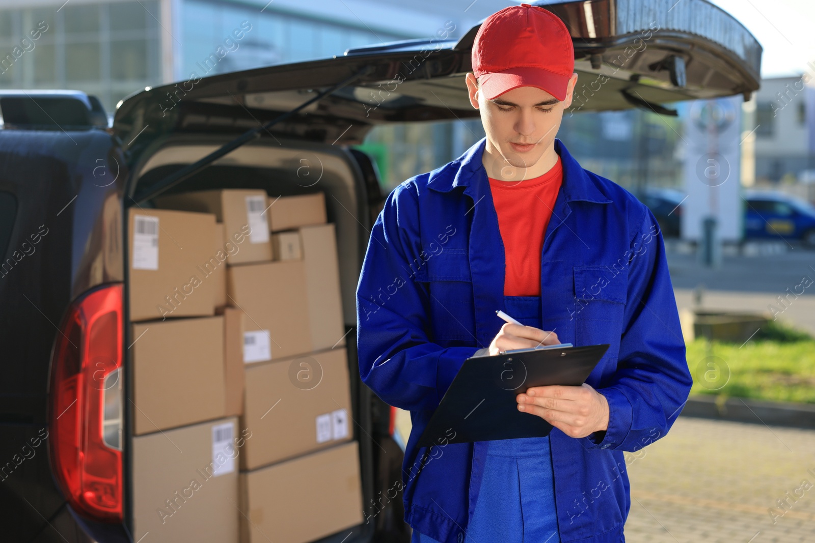 Photo of Courier with clipboard near delivery van outdoors, space for text