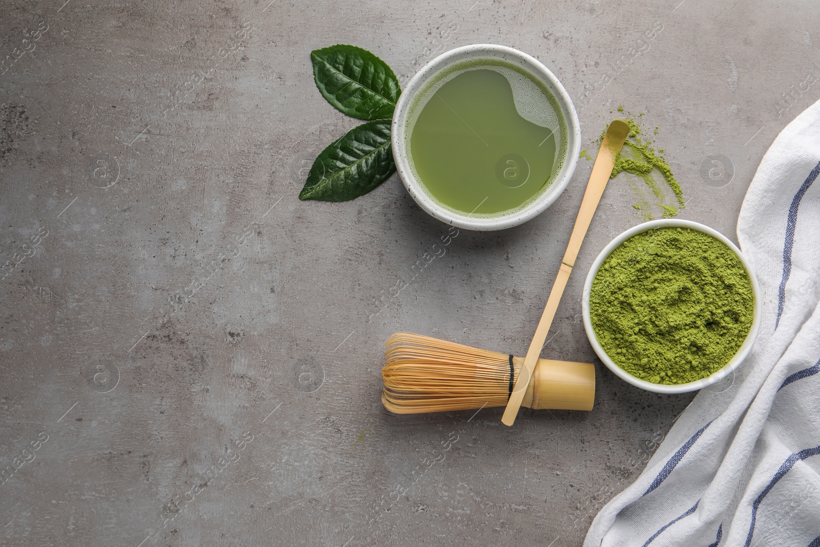 Photo of Flat lay composition with green matcha powder and fresh beverage on light grey table. Space for text