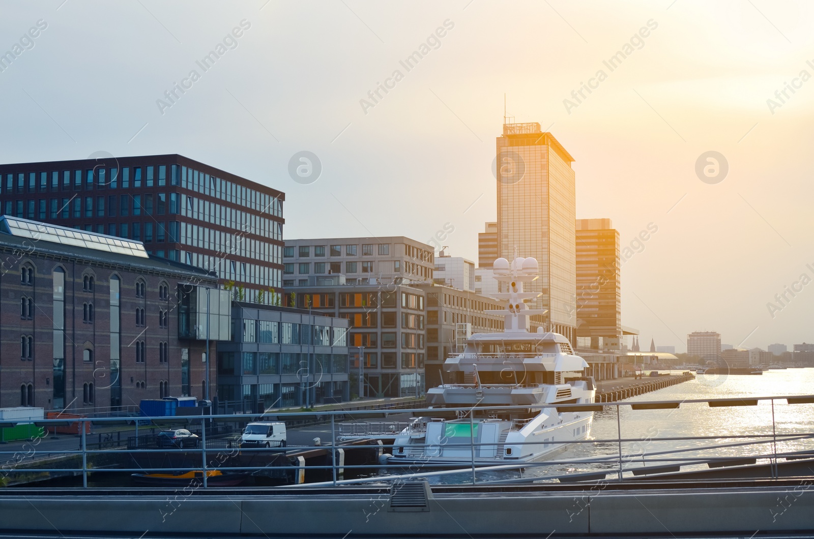 Photo of Beautiful view of cityscape with yacht on river