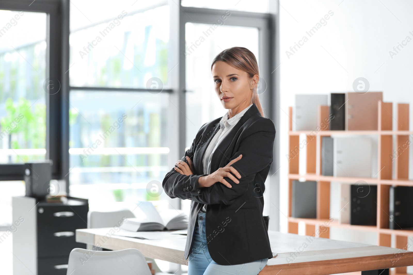 Photo of Portrait of female business trainer in office wear at workplace