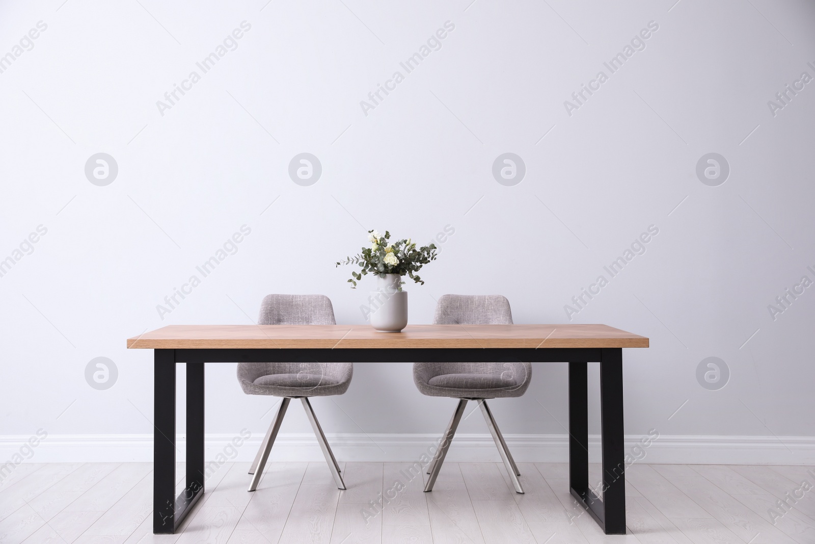 Photo of Stylish room interior with table and chairs. Idea for design