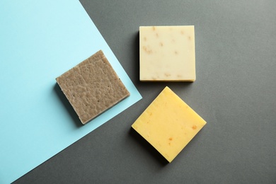 Photo of Hand made soap bars on color background, top view