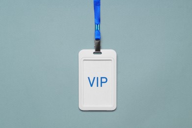 Photo of Plastic vip badge on light background, top view