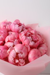 Bouquet of beautiful pink peonies on white background, closeup