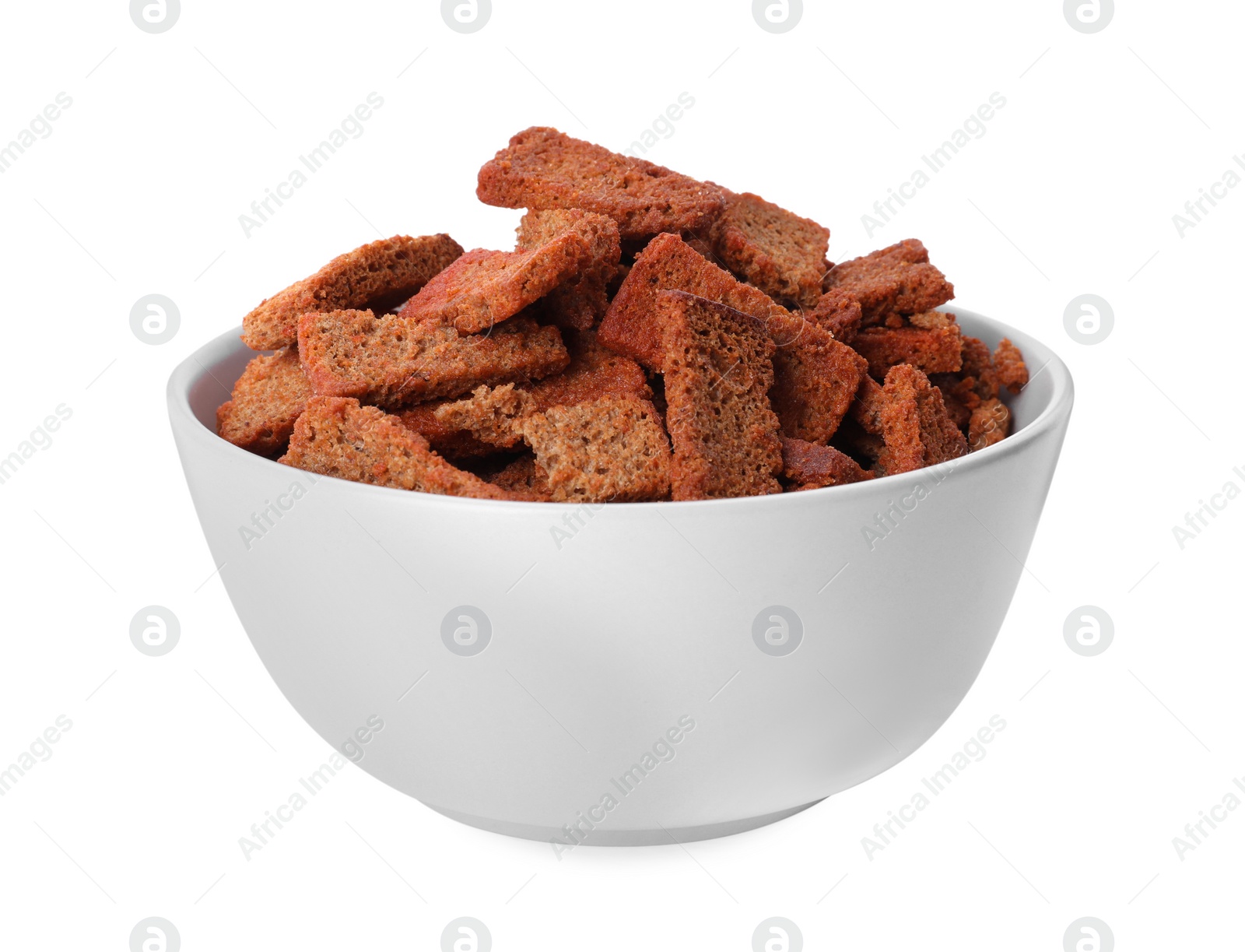 Photo of Crispy rusks with seasoning in bowl isolated on white