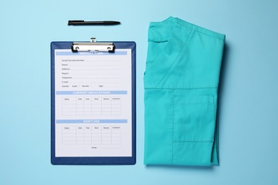 Photo of Medical uniform and clipboard on light blue background, flat lay