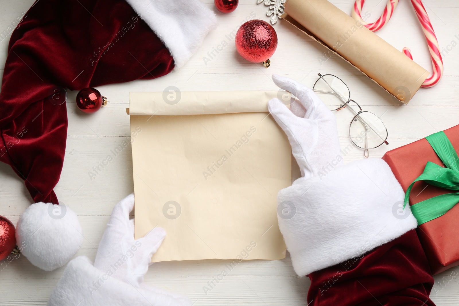 Photo of Santa letter at white wooden table, top view