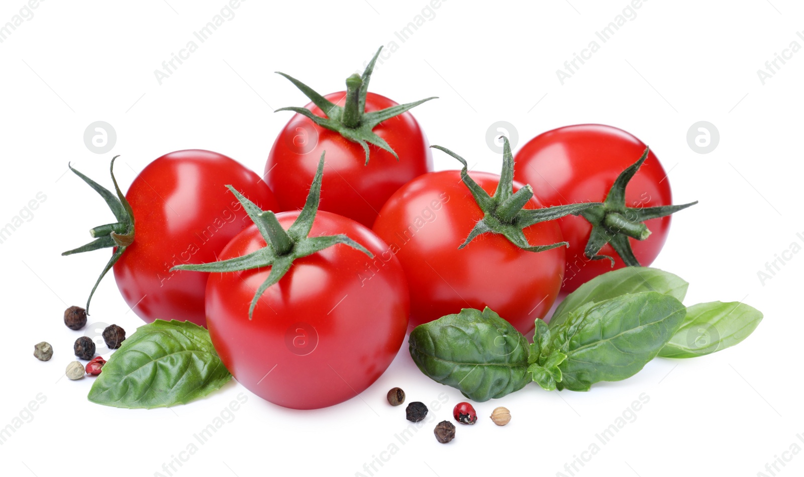 Photo of Fresh green basil leaves, spices and tomatoes on white background