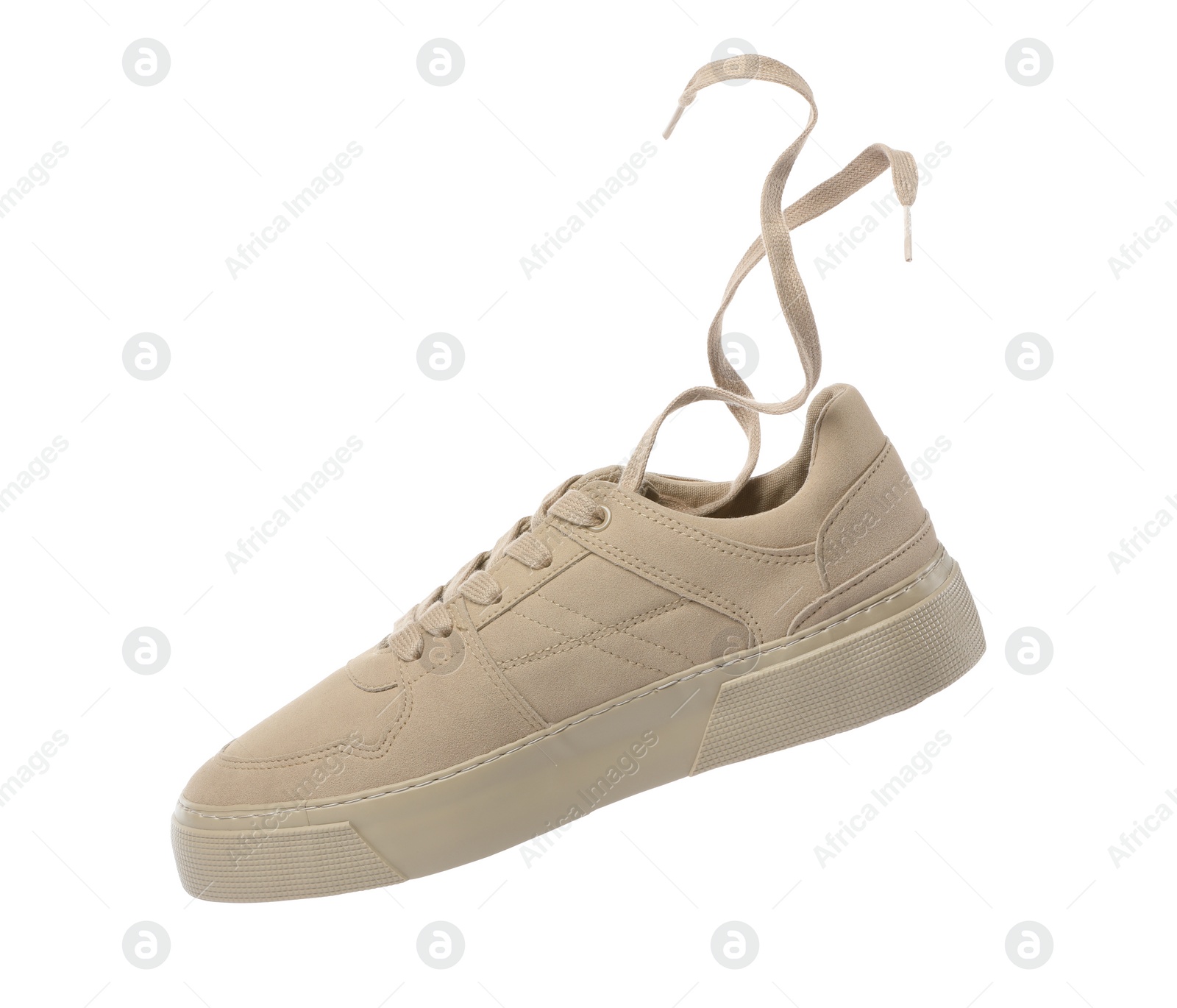 Photo of One stylish beige sneaker isolated on white