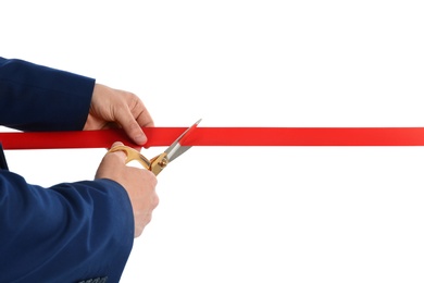 Photo of Man in office suit cutting red ribbon isolated on white, closeup