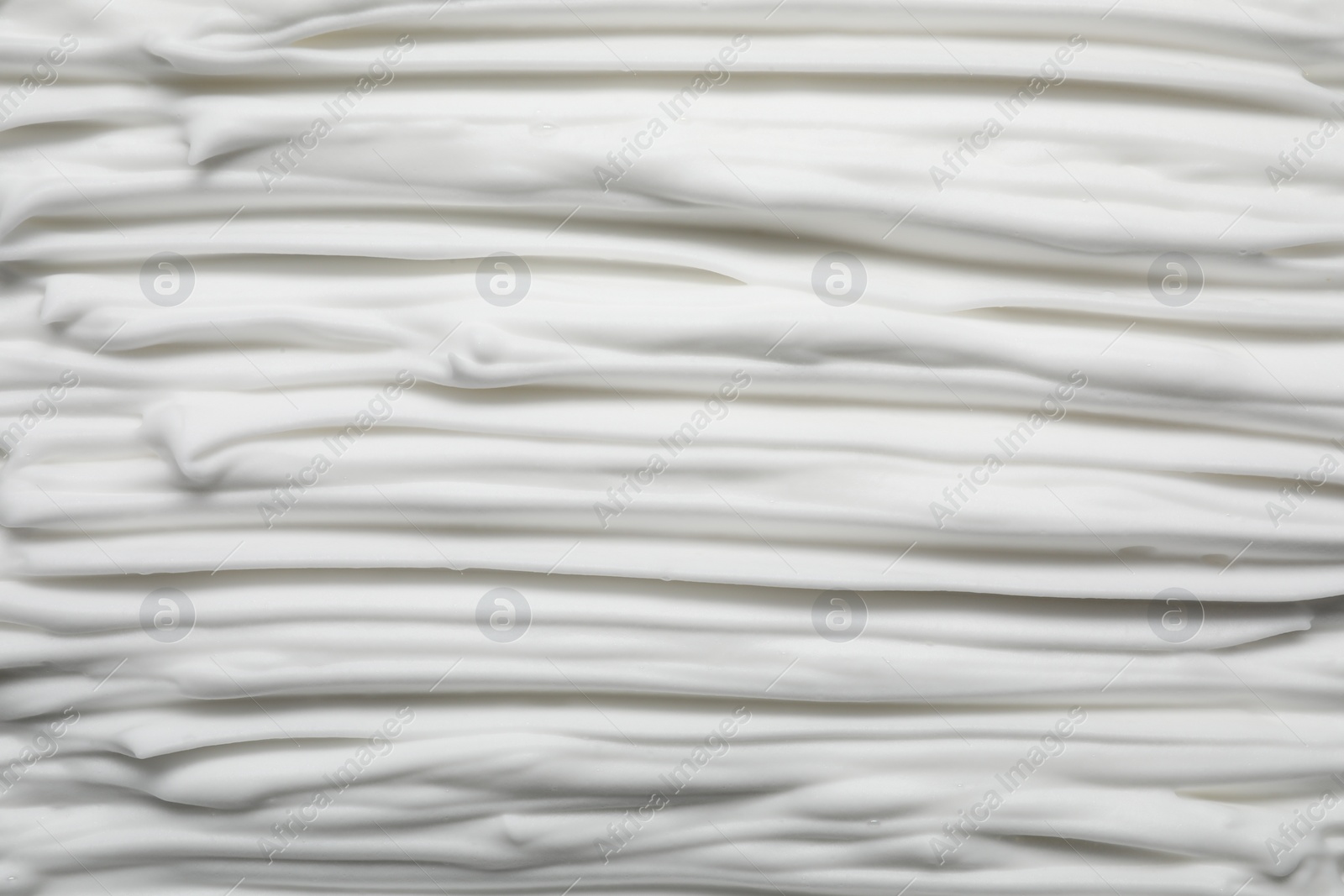 Photo of Texture of white shaving foam as background, top view