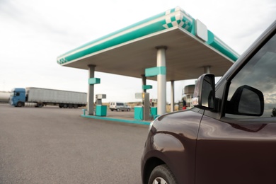 Modern car near gas filling station, closeup