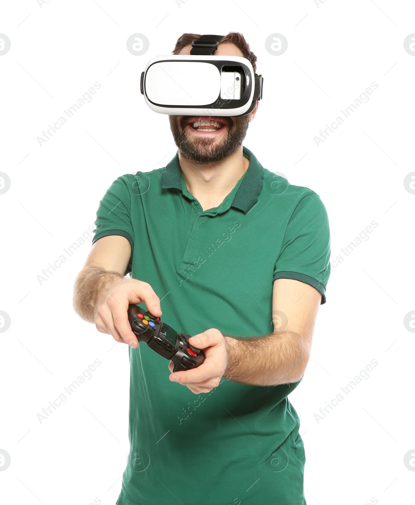 Photo of Emotional young man playing video games with virtual reality headset and controller isolated on white