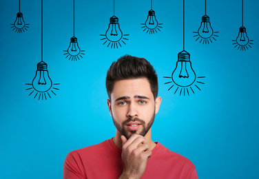 Lightbulbs illustration and thoughtful man in casual outfit on blue background. Business idea