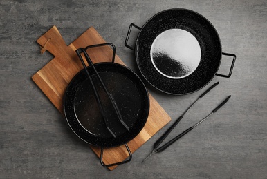 Set of cooking utensils on grey table, flat lay