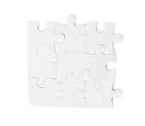 Photo of Blank puzzle pieces isolated on white, top view