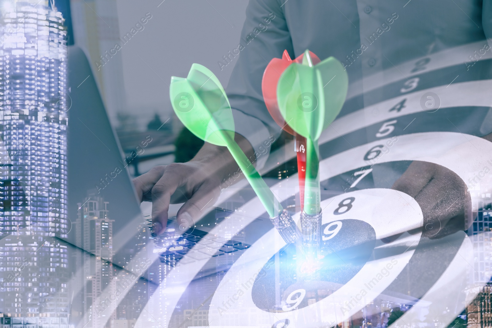 Image of Businessman working with laptop and dart board. Double exposure