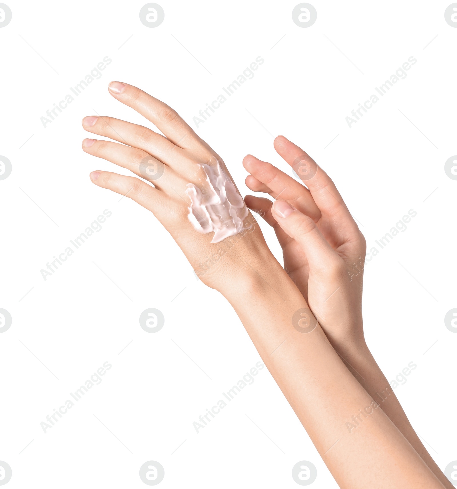 Photo of Young woman applying hand cream on white background