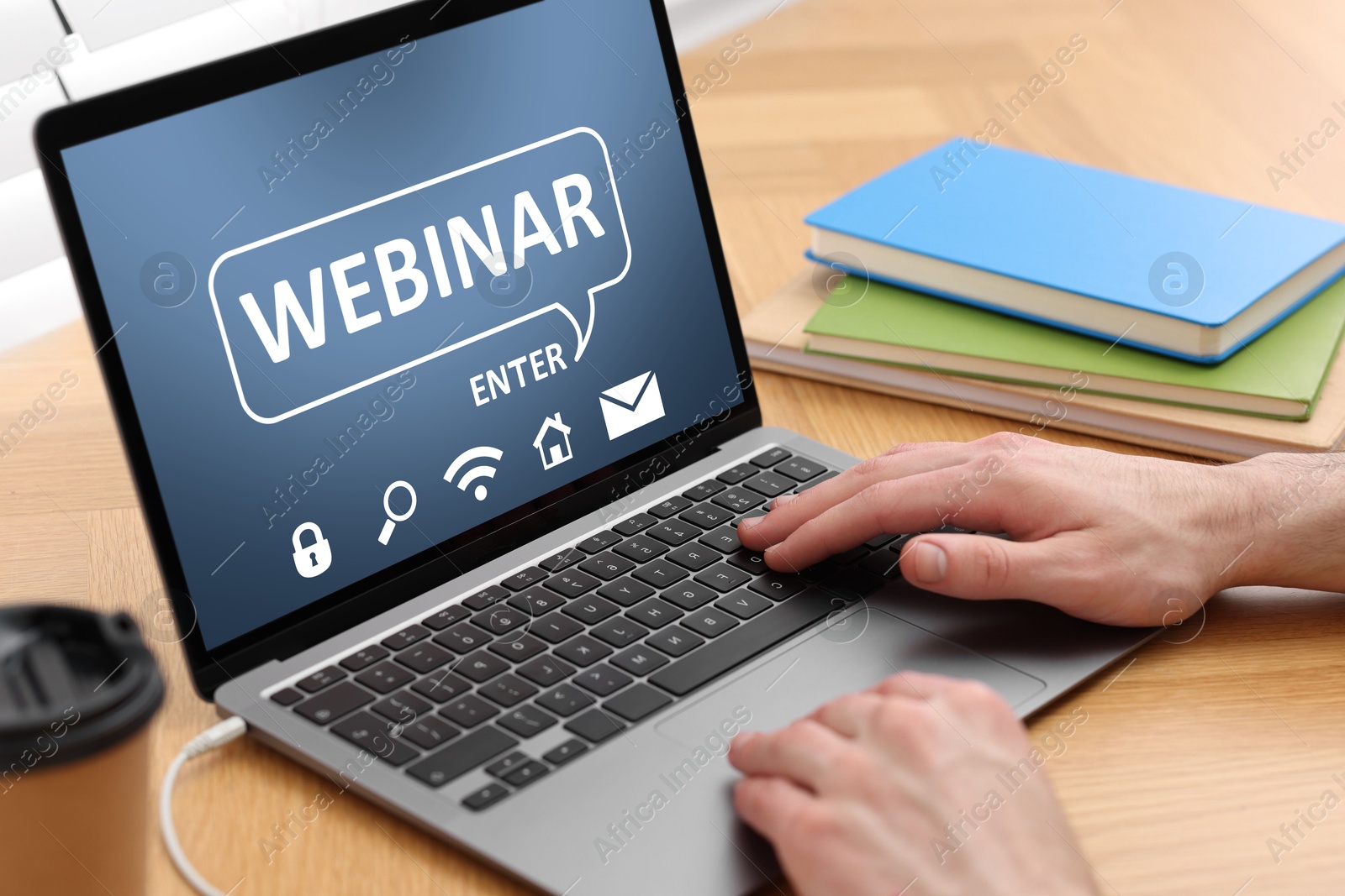 Image of Webinar. Man using laptop at table, closeup