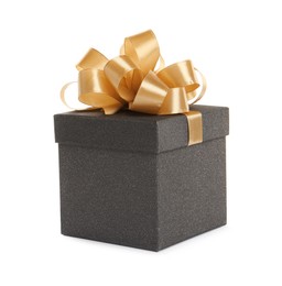 Black gift box with golden bow on white background