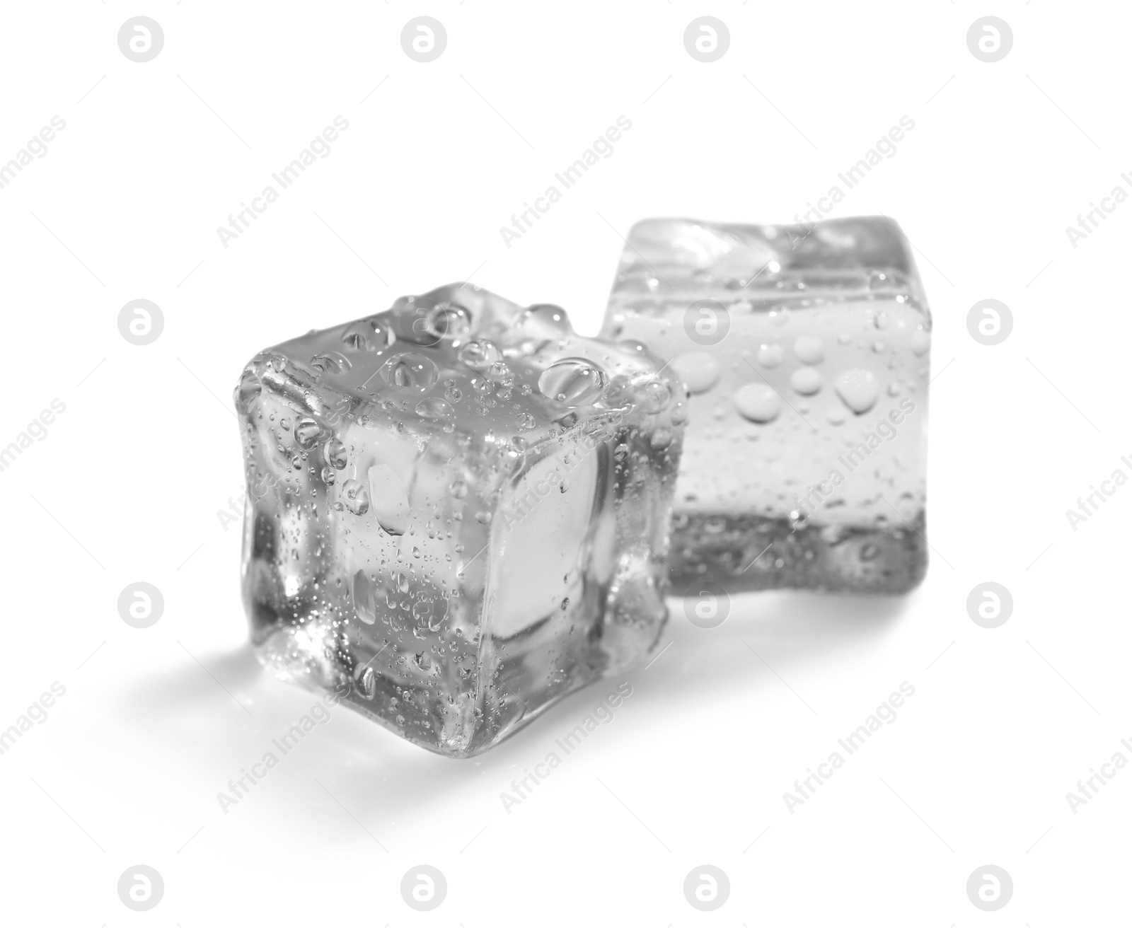 Photo of Crystal clear ice cubes on white background