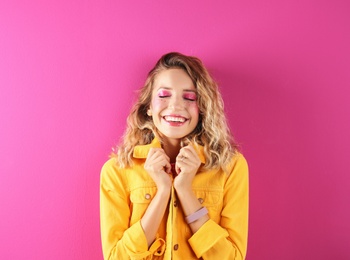 Beautiful young woman posing on color background. Summer fashion