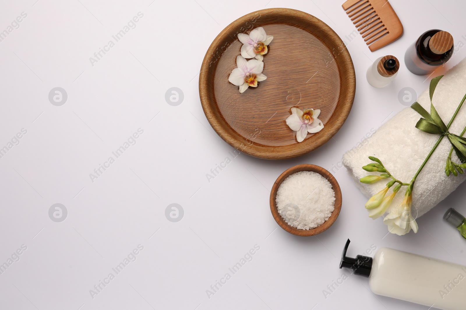 Photo of Flat lay composition with different spa products on white background. Space for text