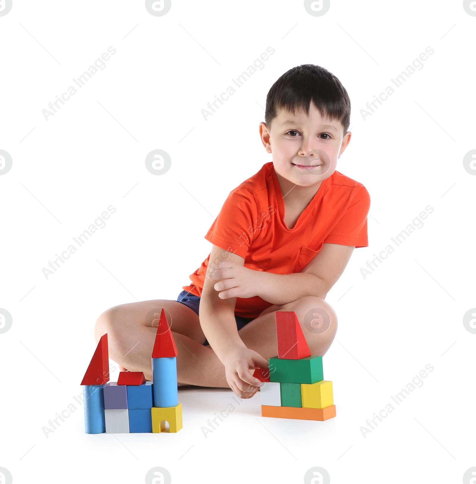 Photo of Cute child playing with colorful blocks on white background