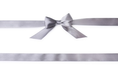 Photo of Grey satin ribbons with bow on white background, top view