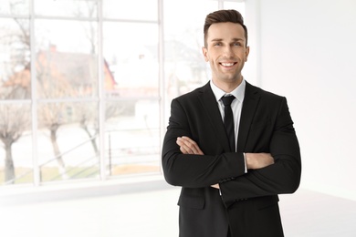 Male real estate agent indoors