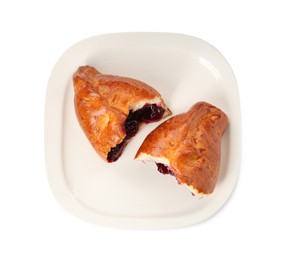 Delicious baked patty with cherry on white background, top view