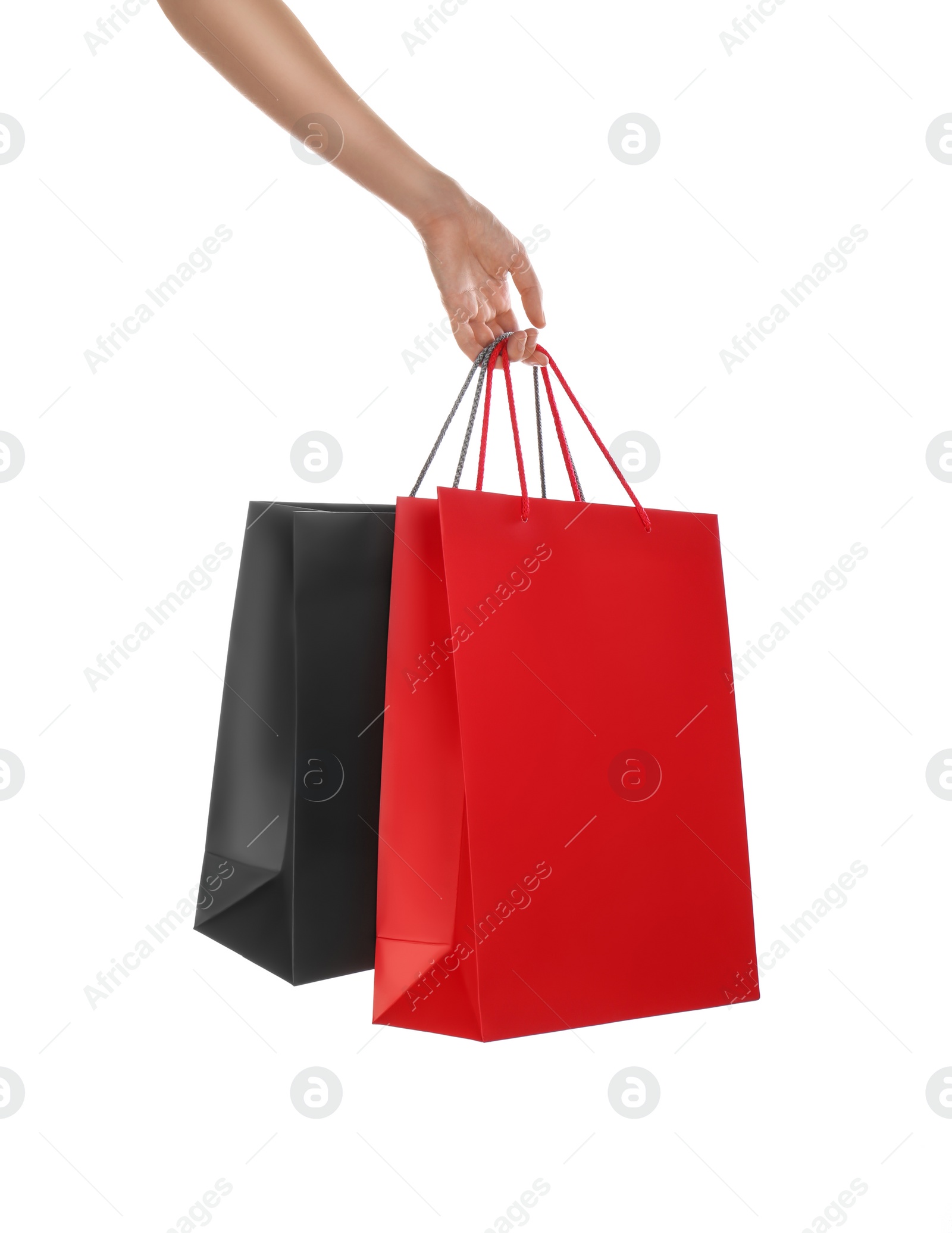 Photo of Woman with paper shopping bags on white background, closeup