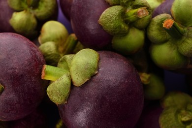 Photo of Delicious fresh mangosteen fruits as background, closeup