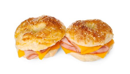 Photo of Delicious bagels with ham and cheese isolated on white